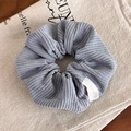 Detailed macro view of the grey-blue corduroy hair scrunchie with soft ribbed texture - Grey Blue Scrunchie (24309B)