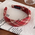 Detailed macro view of the handmade red plaid wide fabric headband with a woven label - Red Large Plaid