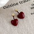 Elegant burgundy heart enamel stud earrings with gold bead detail on beige linen fabric - Burgundy