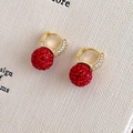 Elegant gold earrings with red crystal spherical pendants and white diamond accents - Red & Gold