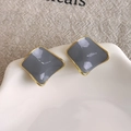Detail of geometric square stud earrings featuring grey enamel with gold-plated edges - Irregular Wavy Gray Style (27861D) / Gray