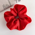 Detail of red satin scrunchie with silky texture and elegant folds for festive hair styling - Large Red Satin Style (25705B)