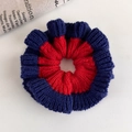 Detailed close-up of knitted scrunchie with vibrant red and navy blue contrasting edges - Red Blue Contrast Rib Knit Style (27516A)