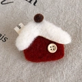 Macro shot of handmade red felt house brooch with wood button on a linen surface - Red House (27870B)