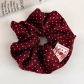 Detailed macro view of dark red polka dot scrunchie with sweet berry woven label - Dark Red Polka Dot Cherry Label Style (27837B)