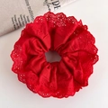 Detailed macro view of the festive red cotton scrunchie with floral embroidery edges - Bright Red Embroidery Lace Edge Style (26137B)