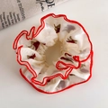 Detail of white silk scrunchie with red floral pattern and pleated red edge stitching - Floral with Red Pleated Edge Style (26652)