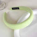 Detail of light green sponge headband showing fabric texture and HAND MADE woven label - Matcha Cream Green