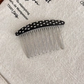 Close-up of retro polka dot acetate hair comb with twelve durable metal teeth - Polka Dot Style / Black