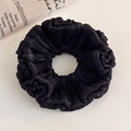 Close-up of black organza scrunchie featuring elegant pleated satin texture and high elasticity - Black