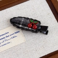 Detail of red cherry hair clip with black and white tweed fabric on scalloped edge - Black Plaid with Cherry