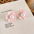 Macro detail of soft pink chiffon flower earrings with a delicate center pearl accent - Pink Flower