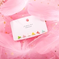 Macro view of six colorful whale tail stud earrings on a card with pink feathers - Whale Tail Macaron Style (13818M Silver Post)