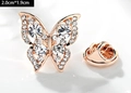Macro detail of a rose gold butterfly brooch with sparkling rhinestones and metal clutch back - Butterfly (X0234) / 2.0cm x 1.9cm / White