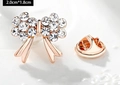 Macro shot of rose gold bow brooch with white crystals measuring 2.0cm x 1.8cm - Bowknot (X0234) / 2.0cm x 1.8cm / White
