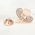 Detailed macro view of rose gold sun hat brooch with crystals and peach cat eye stone - Sun Hat (X0234) / Rose Gold