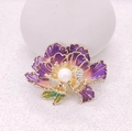 Macro view of purple enamel peony brooch with white pearl and sparkling rhinestones - Purple
