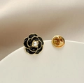 Elegant black enamel camellia flower brooch with gold trim and white pearl detail - Black Camellia Style