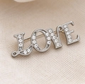 Elegante spilla LOVE argento con pavé di cristalli scintillanti su tessuto bianco - Stile Lettera LOVE (6210403351050) / Argento