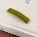 Detail view of the soft grass green flocked texture and rectangular design on this plush hair clip - Green