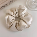 Close-up of cream PU leather scrunchie with elegant pleated cloud texture for hair - White Large