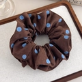 Detailed view of dark brown scrunchie with light blue polka dots and matte texture finish - Coffee Style (27580B)