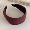 Detailed close-up of wine red fabric headband with non-slip interior and fine texture - Brown Red