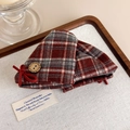 Close-up of retro plaid hair claw with vintage button and velvet bow decoration - Red