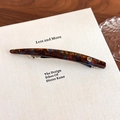 Detail of tortoiseshell acetate hair clip with gold emblem on white minimalist card - Mocha Blue (27606D)