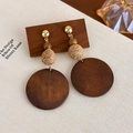 Detail view of retro geometric wooden earrings with woven rattan ball and gold metal stud - Woven Ball Large Wood Disc (27624E)
