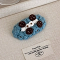 Detailed macro view of handmade blue crochet hair clip with cute biscuit design element - Biscuit Style (27629E)