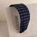 Detailed texture of wide plaid headband with grey and black striped wool fabric - Blue and Grey Plaid