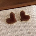 Macro shot of vintage heart velvet studs with golden frames on a rustic texture - Brown Heart