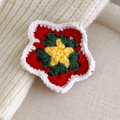 Detail of handcrafted crochet star hair clip with festive red, green and yellow knit texture - Five-Pointed Star (27706E)