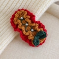 Close-up of handmade knit Christmas hair clip with white pearls and green bow detail - Red Coffee Base Green Knot (27706J)