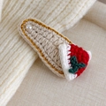Detail of crochet Christmas hair clip with knit hat and holly on beige texture - Christmas Hat (27706N)