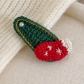 Detail of Christmas knitted hair clip with red sock and white pearl on green base - Christmas Sock (27706R)