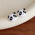 Detail of panda earrings featuring black and white enamel work with crystal accents - Panda