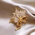 Sparkling crystal maple leaf brooch in gold finish with marquise cut zircons - Gold