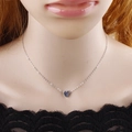 Minimalist silver heart pendant necklace on model showcasing the delicate metal chain - Silver