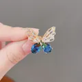 Eleganter Schmetterlings-Brosche in Gold mit blauem Farbverlauf und Kristallen für Damen - Blaue Schmetterlingsbrosche