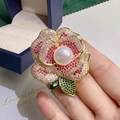 Detailed macro of a luxury camellia brooch with gradient crystals and a central pearl - Gradient Floral Style (6218827378090) / Colorful