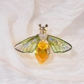 Sparkling bee brooch with a large yellow pear-shaped gemstone and green resin wings - Green