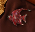 Macro detail of high-end tropical fish brooch with red rhinestones and vintage alloy base - Tropical Fish Shape / Red