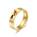 Polished gold stainless steel wide band ring featuring a dangling cross charm - Gold Cross