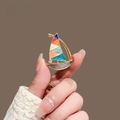 Elegant gold sailboat brooch with colorful enamel sails and sparkling rhinestone accent - Sailboat Style (XL0050)