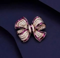 Broche nœud en cristal fuchsia avec finition dorée et strass blancs - Violet