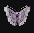 Elegant butterfly brooch in silver with sparkling purple and white crystals on black background - Silver