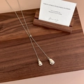 Minimalist silver teardrop Y-necklace with dual polished pendants on a wooden surface - Silver Style