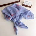 Detailed view of light blue floral cotton scarf with delicate pink flower patterns - Blue Small Floral